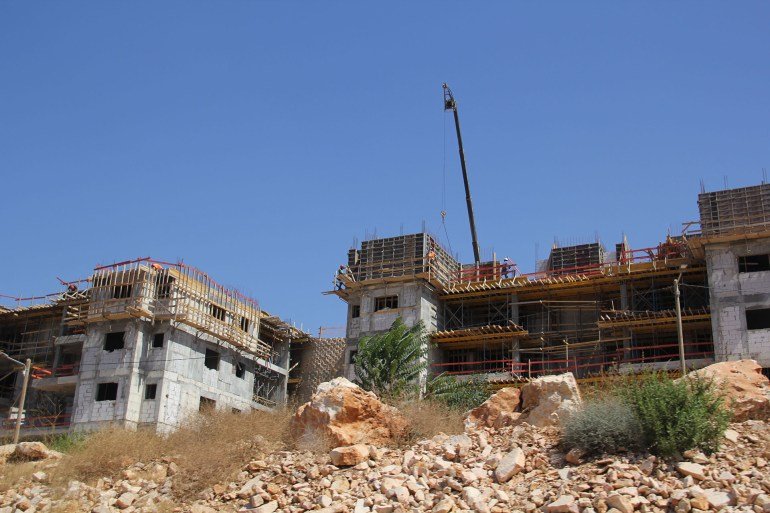 Atef Douglas - One side of the dense and saturated construction composed of several layers in the settlement of Kiryat Netafim - West Bank - Salfit - west of the settlement of Kiryat Netafim, on citizens' lands west of the city of Salfit - Al Jazeera Net 3