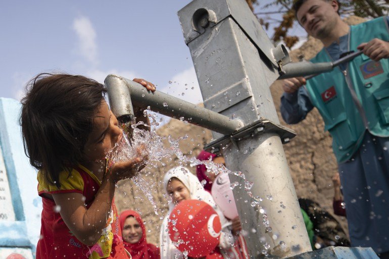 Kabul, Afghanistan - October 31: a child drinks water from the water well in Kabul, Afghanistan, October 31, 2022, because it is voluntarily established by an NGO, the organization of charity and solidarity de Cansuyu. 14 water wells were installed in 14 regions where a water problem has due to drought. (Photo by Muhammed Abdullah Kurtar / Anadolu Agency via Getty Images)